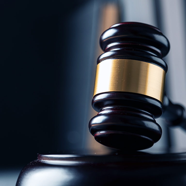 Wooden gavel set with brass detailing, close-up view.