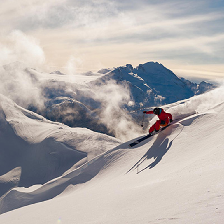 Skiing down a snowy mountain