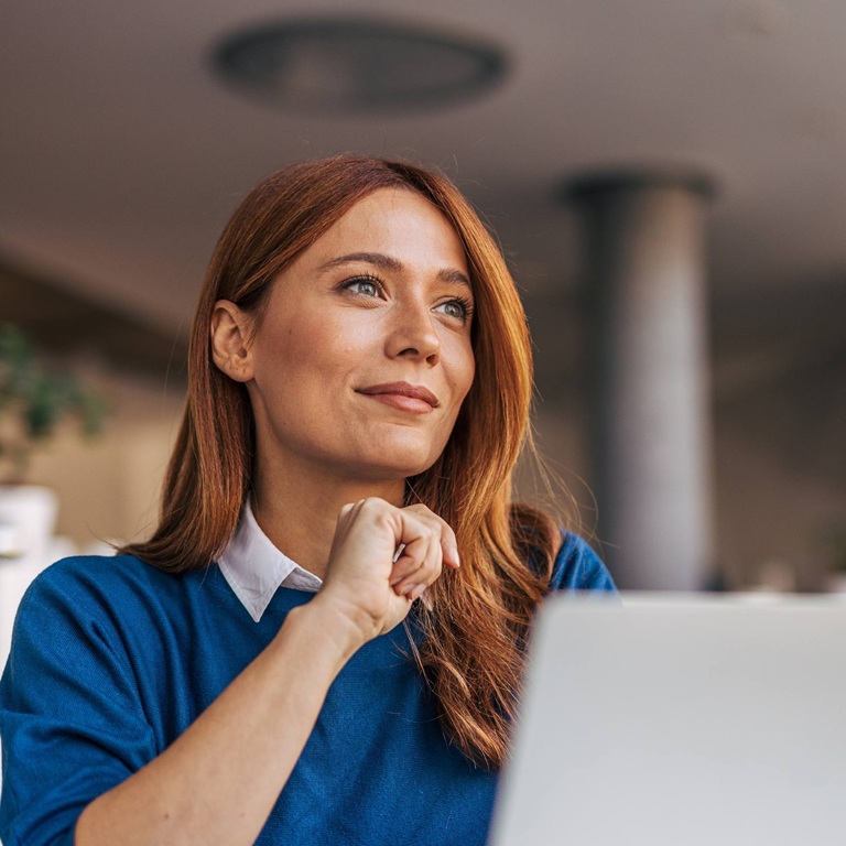 Woman in office sitting at desk