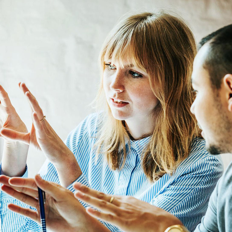 Young professionals, male and femaile, working on new ideas during a meeting