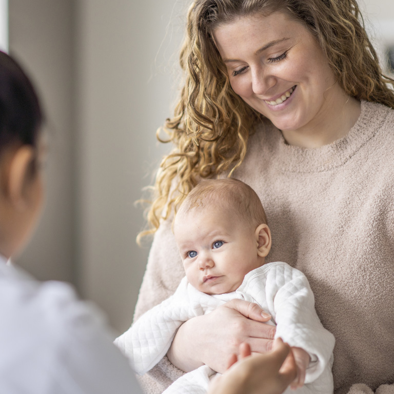 Women holds her baby