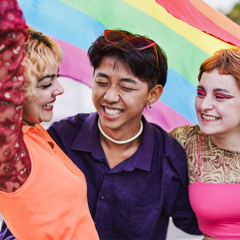 Young diverse people having fun at LGBT pride parade