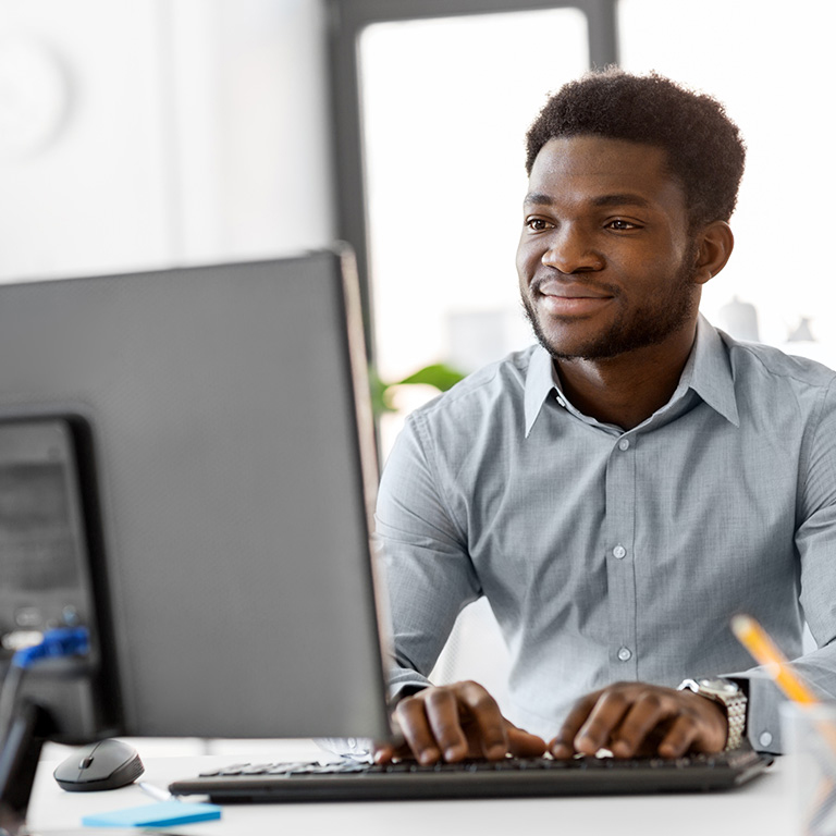 Black businessman with computer at office