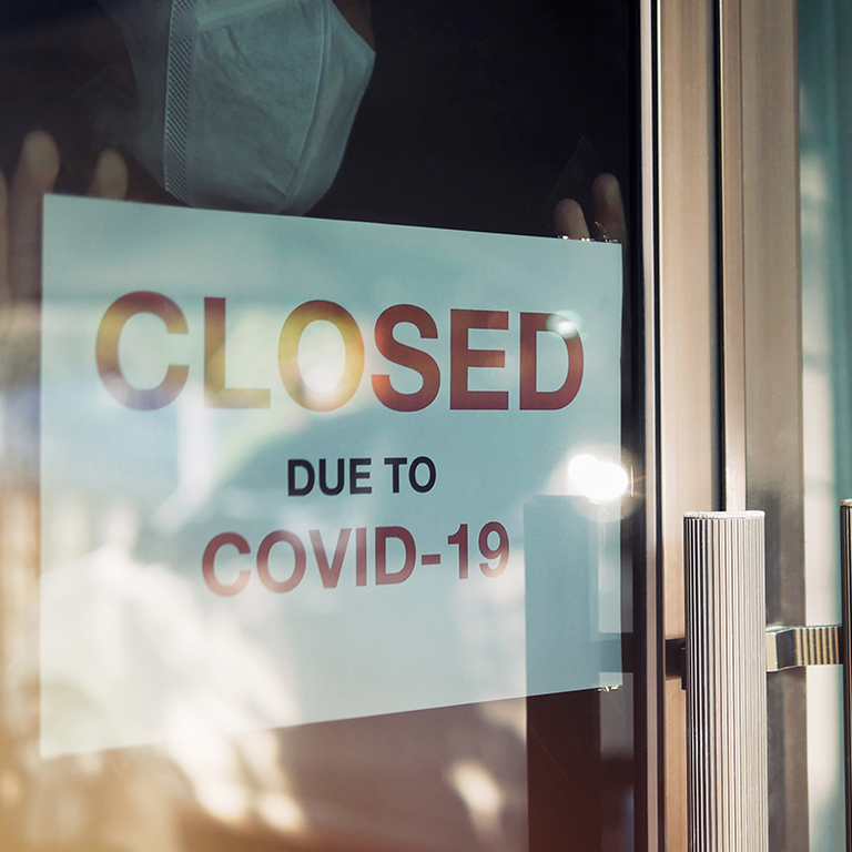 business closed due to covid-19 sign on door