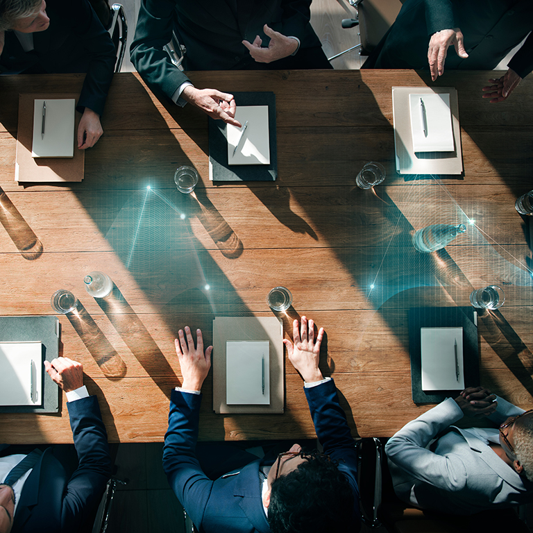 Business people in a meeting from birds eye view.