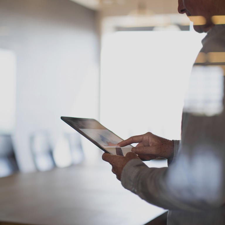 Business meeting with tablet in corporate office