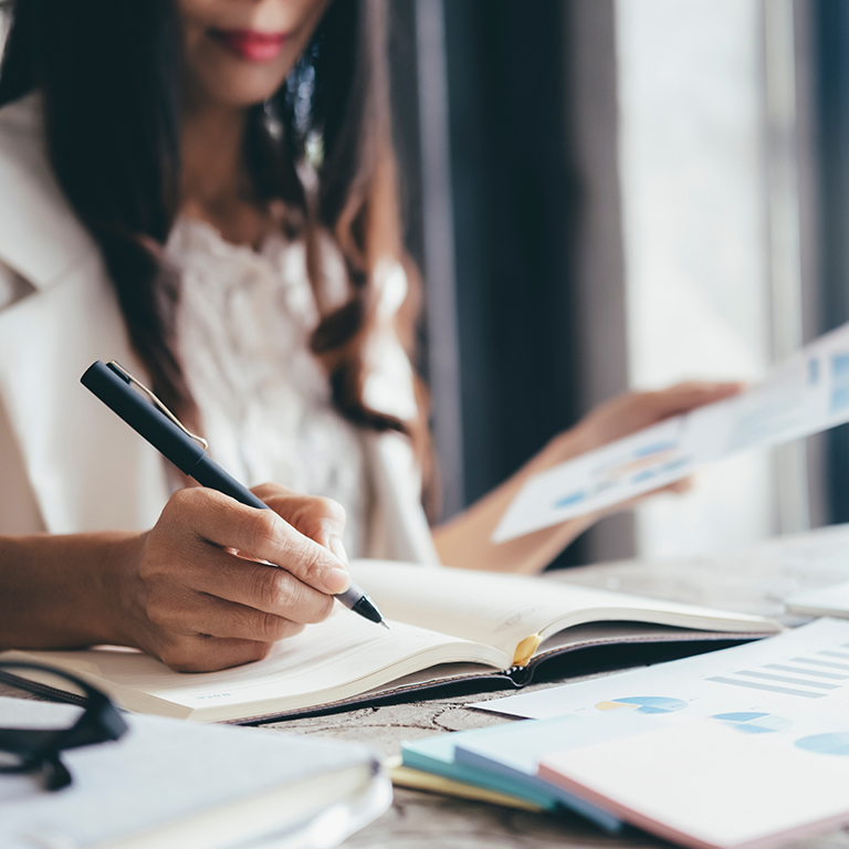 Businesswoman analyse investment marketing data.