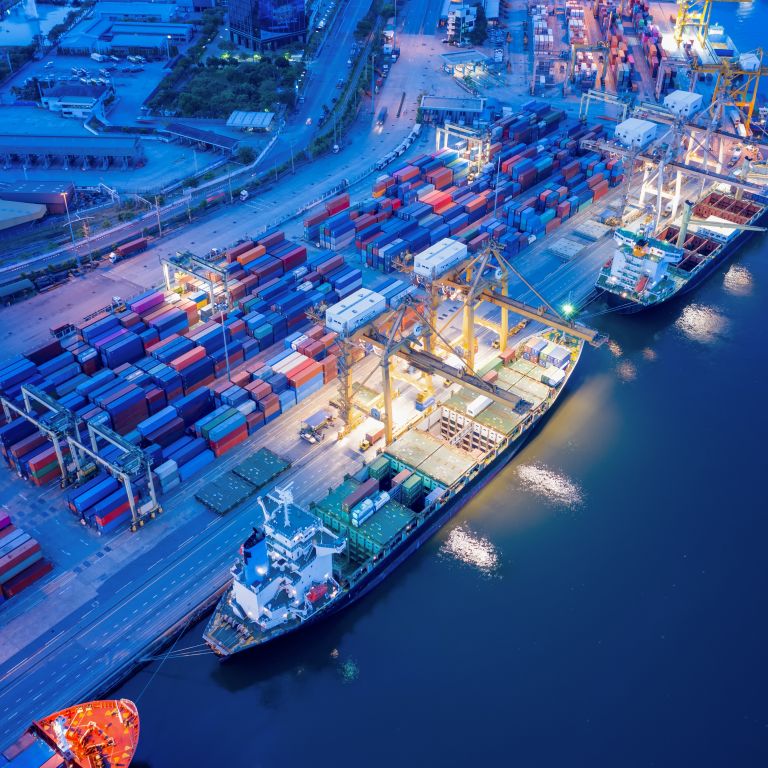 Busy harbor with containers and ships
