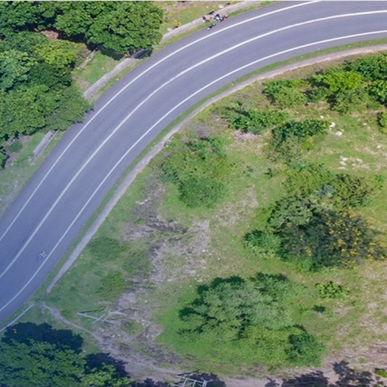 Cars navigate a winding road