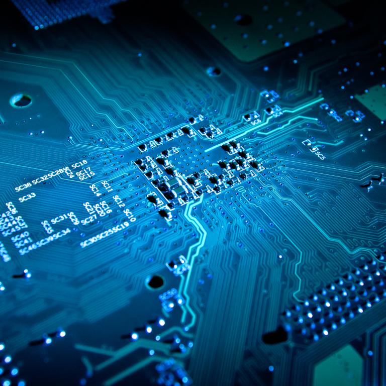 Circuit board design with blue lights and patterns