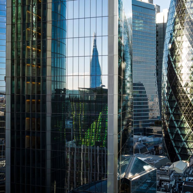 City skyline view with modern buildings and reflections