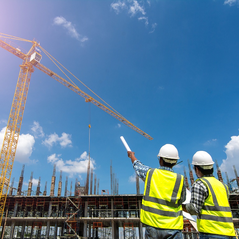 Civil engineer checking work with communication to management team in the construction site