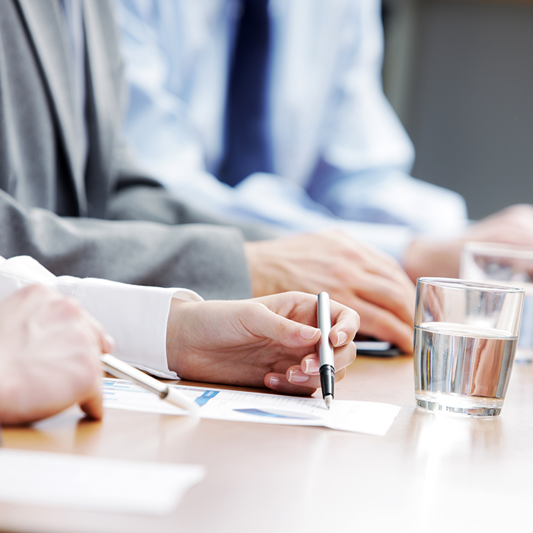 Close up of hands of business people during a meeting