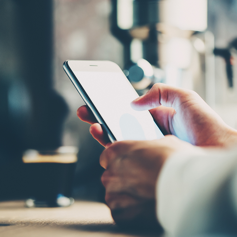 Close up of hands using a smartphone