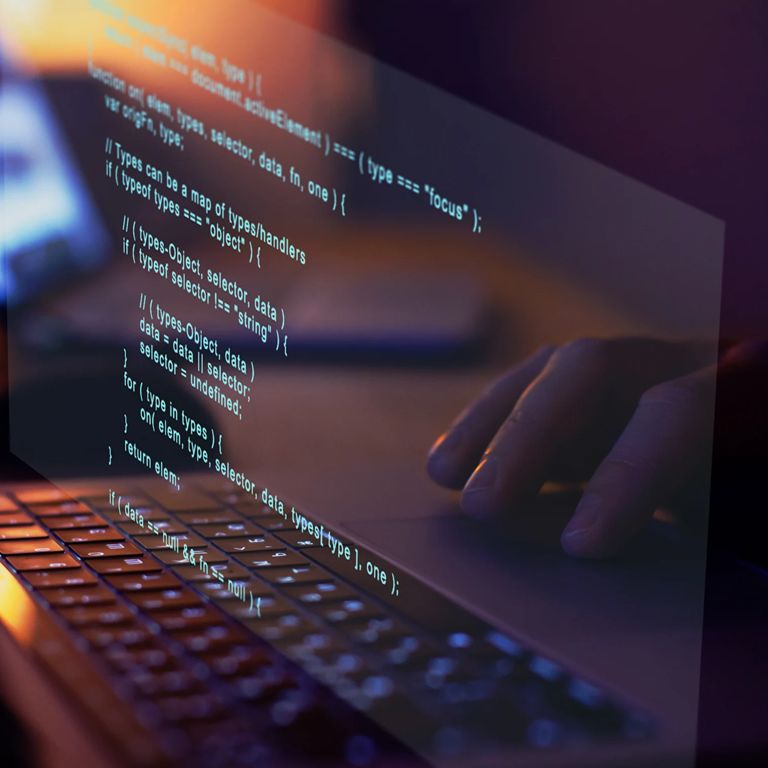 Code reflecting in laptop screen