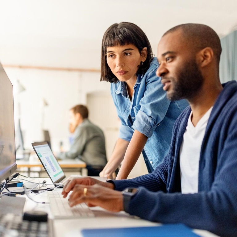 Collaboration between team members in modern workspace