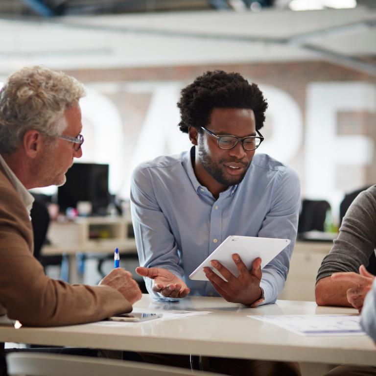 Colleagues discussing work plan
