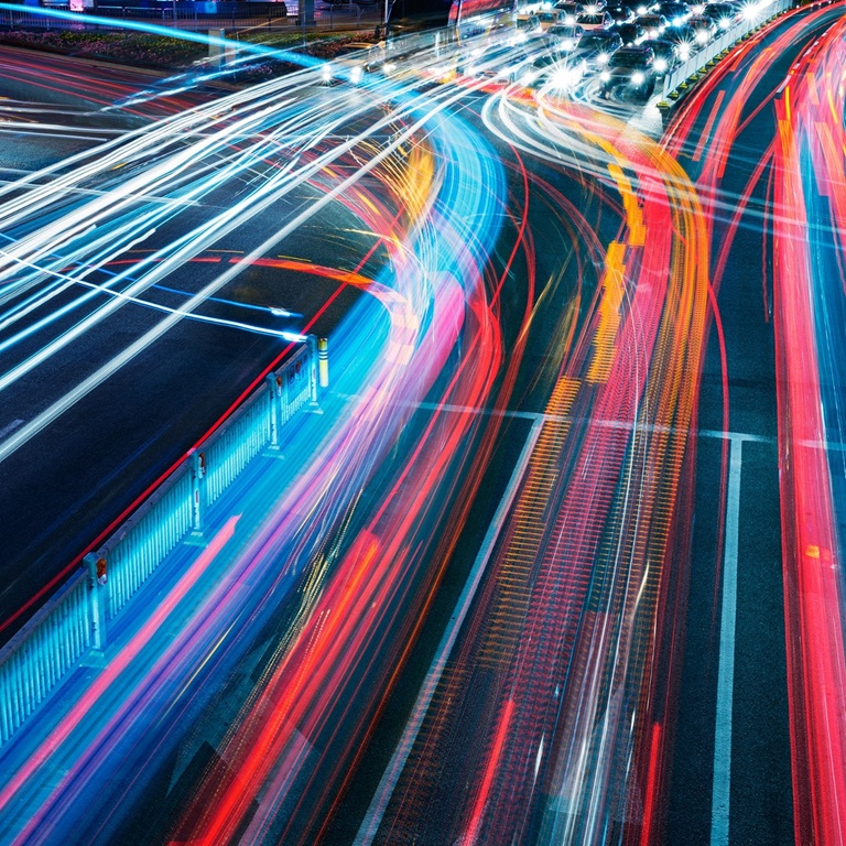 Colorful car lights trail in motion on freeway