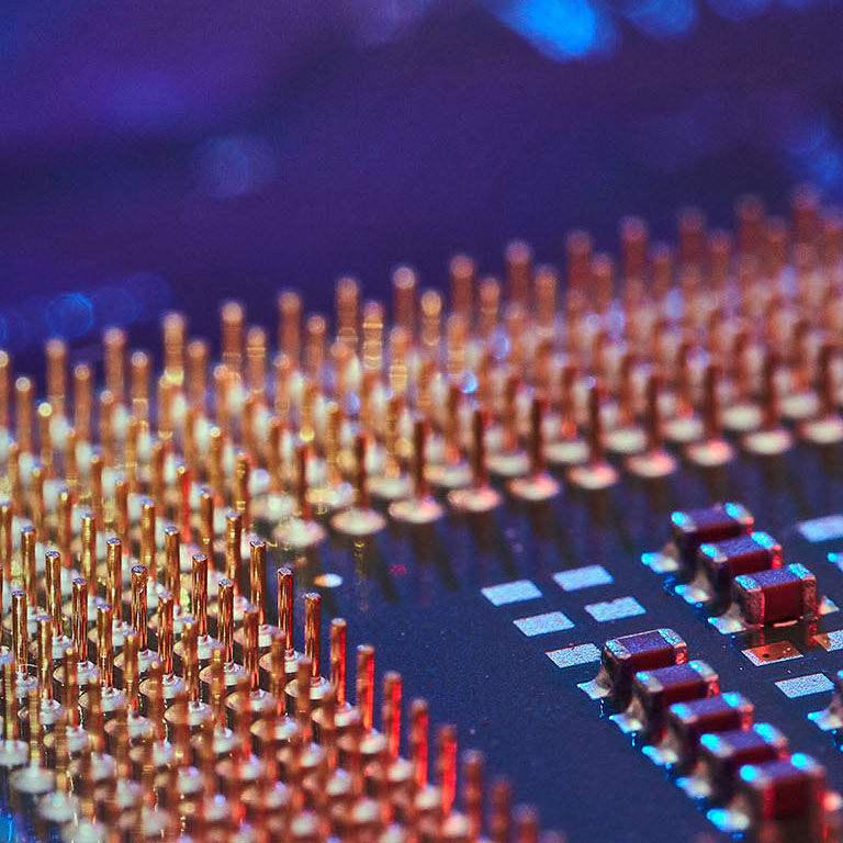 CPU desktop with the contacts facing up lying on the motherboard of the PC. the chip is highlighted with blue light. Technology background. selective focus