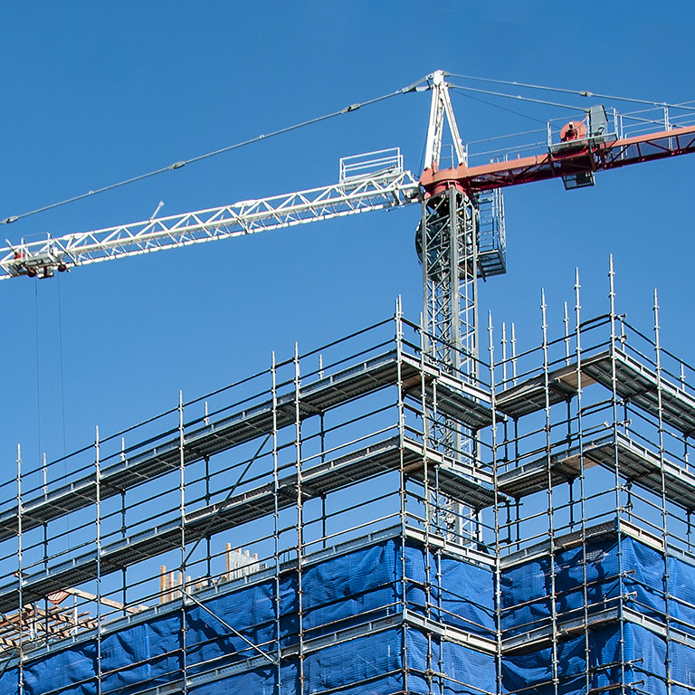 A Working Construction crane on a new high rise multistory building site. Gosford, New South Wales, Australia.