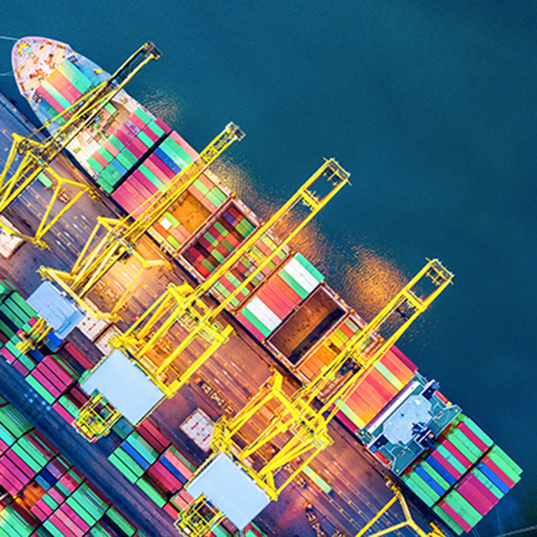 Container cargo ship in import export business logistic at night, Freight transportation, Aerial view