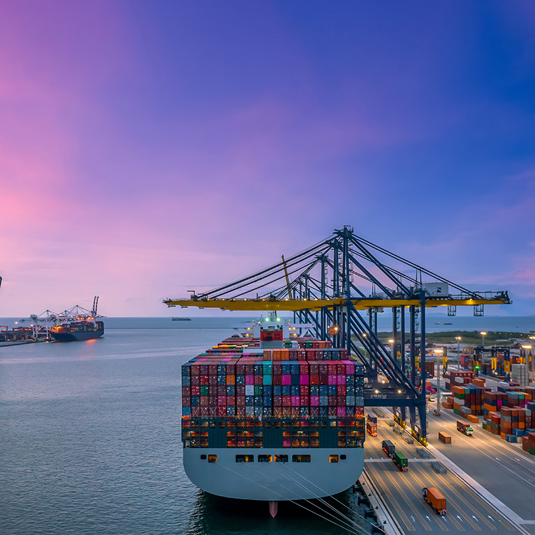 Container ship in seaport at night, Global business logistic import export freight shipping transportation oversea worldwide container ship, Container vessel loading cargo freight ship.