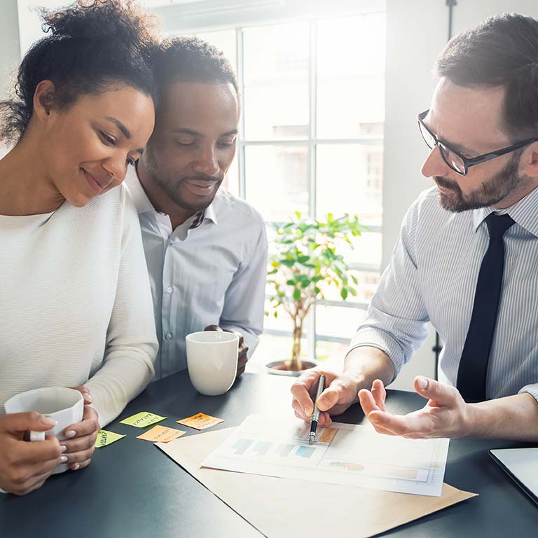 Couple consulting with a insurance broker