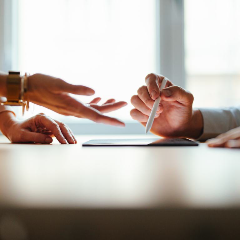 Discussion and writing on a tablet in office setting