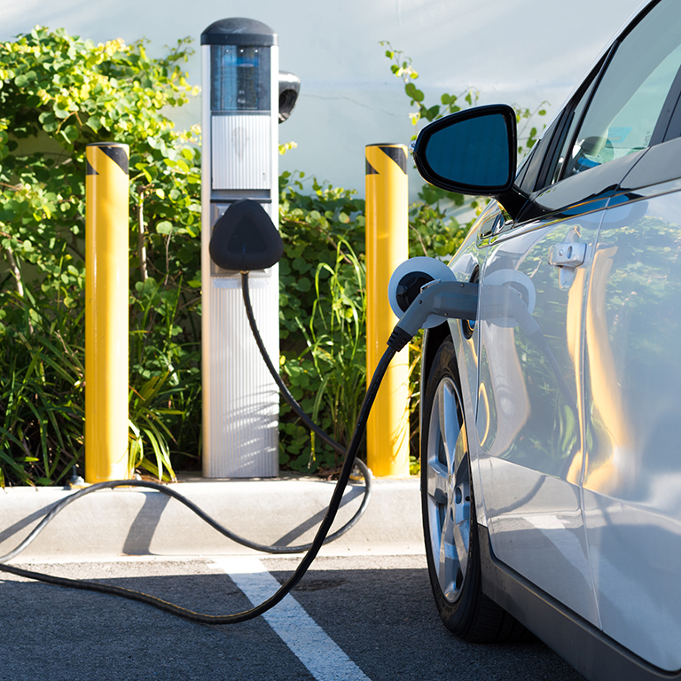 An electric car charging in California