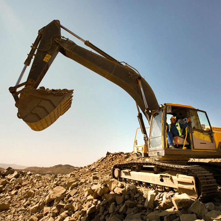 Excavator digging at construction site