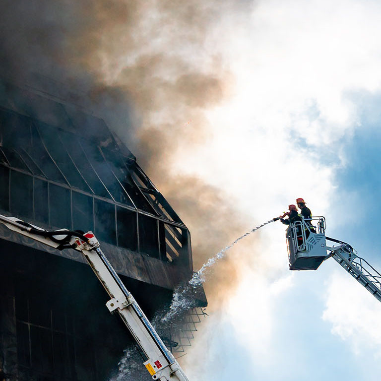 Burning building in thick toxic smoke