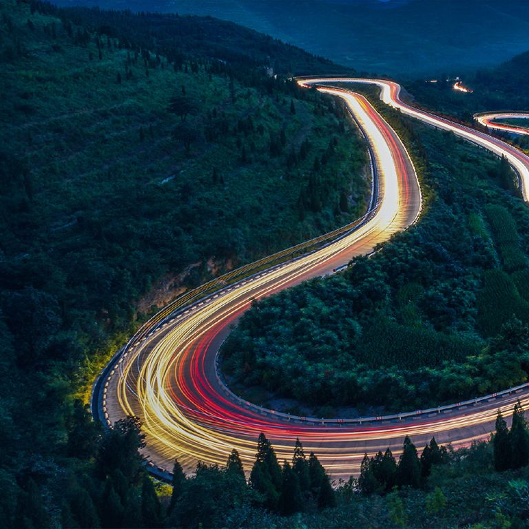 Freeway at night with fast paced vehicules lights