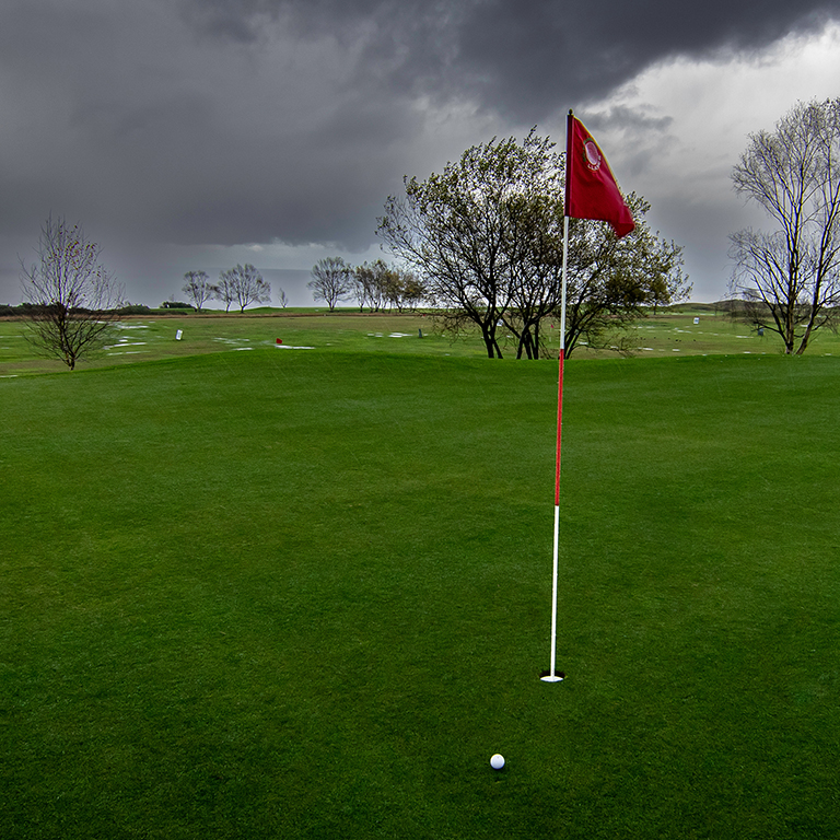 Golf course in stormy weather