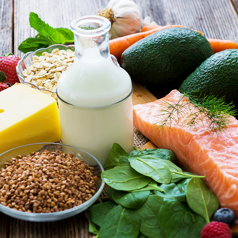 Selection of healthy food on rustic wooden background