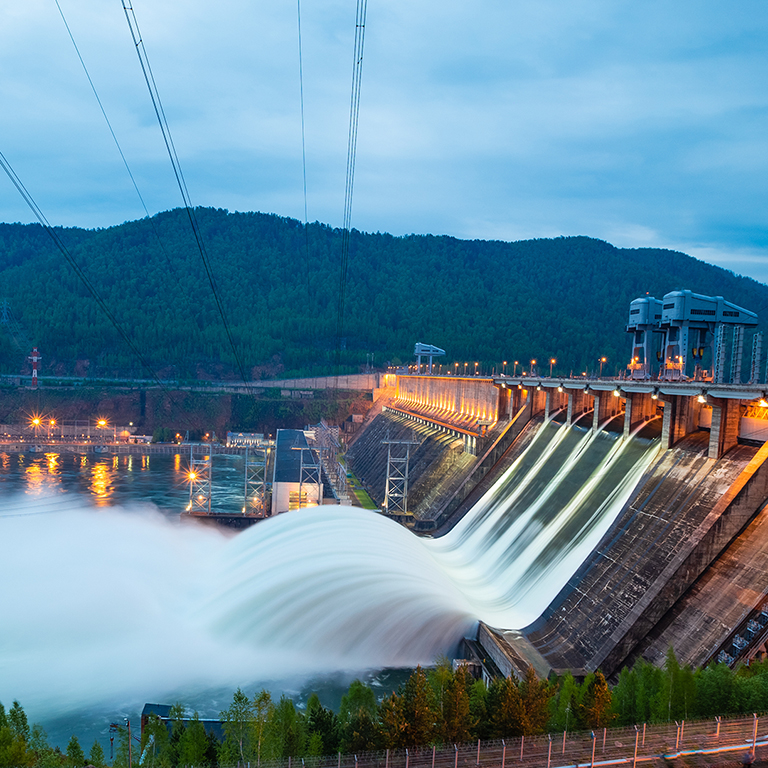 view of the hydroelectric dam, water discharge through locks, long exposure shooting