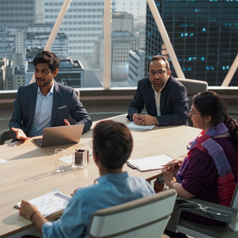 High angle of a team of Indian professionals having a business meeting in the boardroom. 