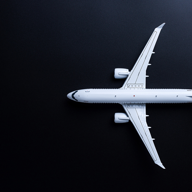 Jet airliner on black background. Plane crash and air incident. The tragedy, deaths, victims and injuries concept.