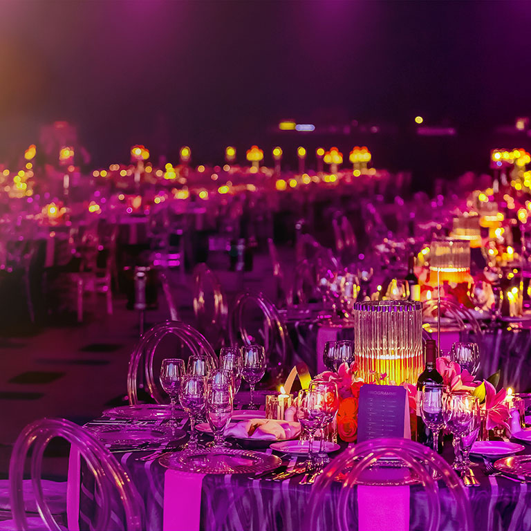 Pink and Purple Christmas Decor with candles and lamps for a large party or Gala Dinner