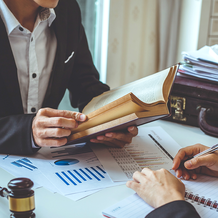 Business lawyer working about legal legislation in courtroom to help their customer