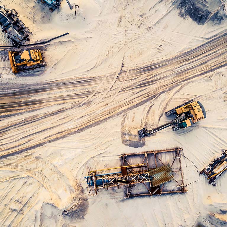 Collection of heavy mining machinery in an open mine