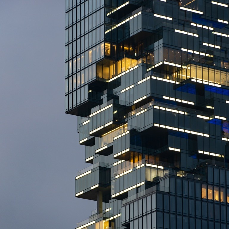 Modern building illuminated in an urban area