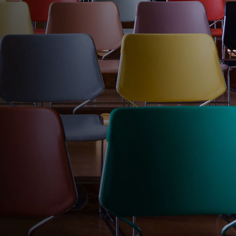 Rows of colorful chairs in Auditorium