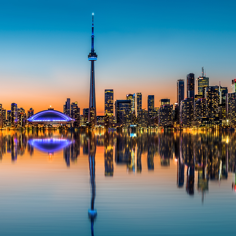 Toronto skyline at dusk, reflected in  the Inner Harbor Bay
