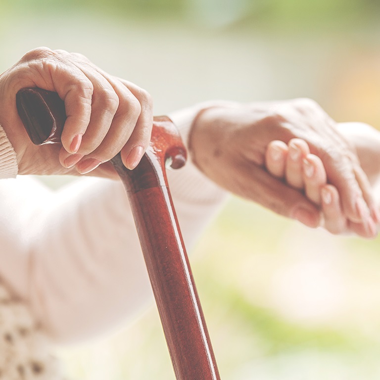 Nurse holding hand of old person