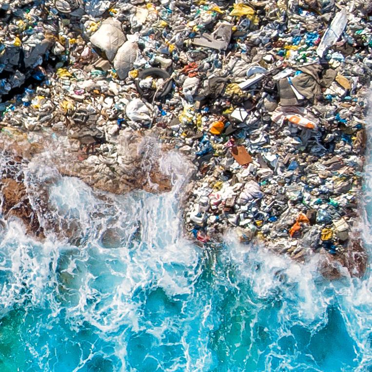 Concept environmental pollution ocean and water with plastic and human waste. Aerial top view.