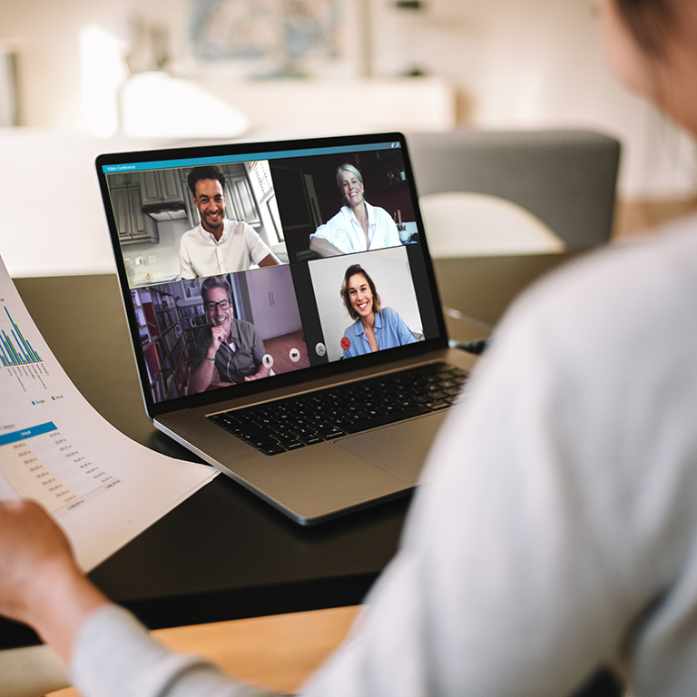 Businesswoman having online business meeting from home with laptop computer