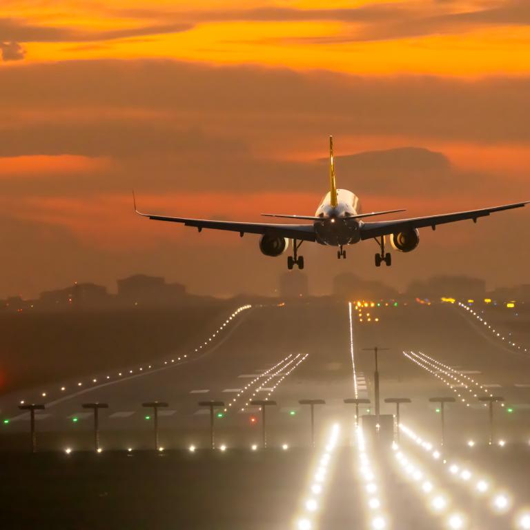 Plane approaches runway at airport