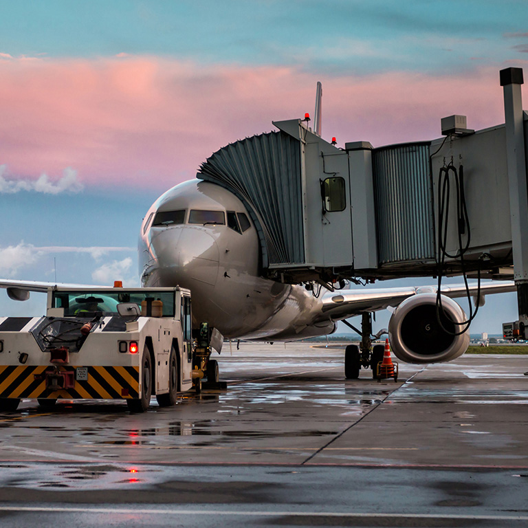 Plane parked at airport landing field