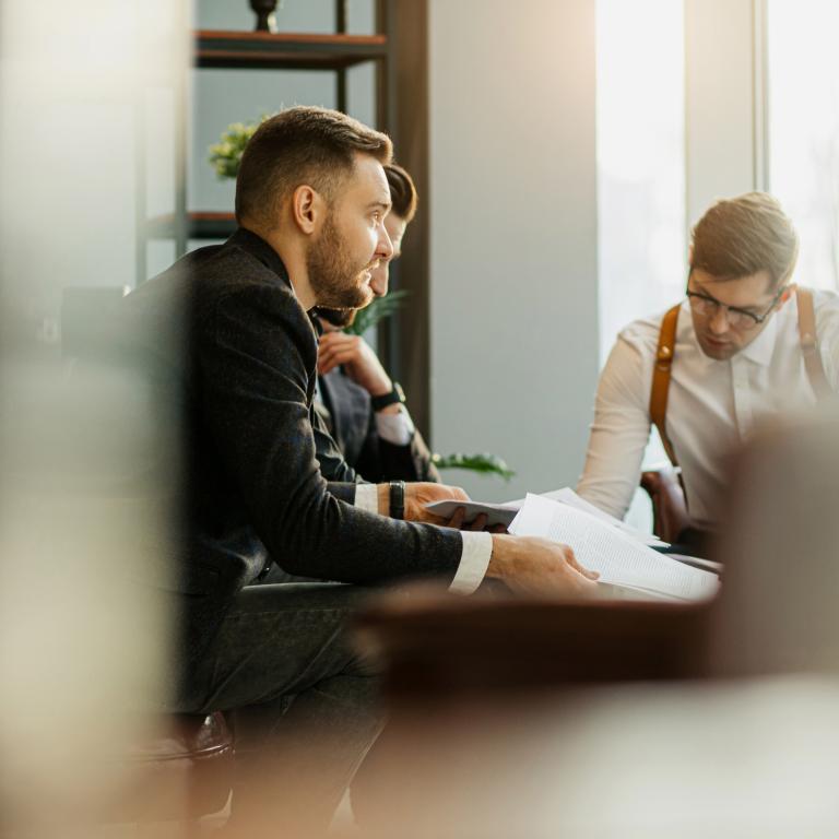 Professionals discuss plans in office