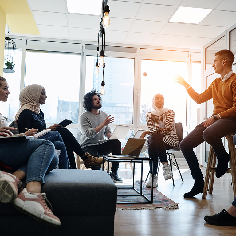 business people group in modern office have a team meeting and brainstorming while working on tablet or laptop  presenting ideas and take notes